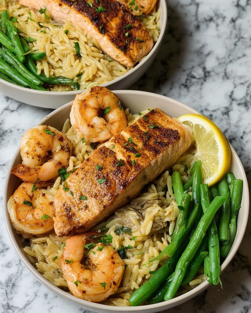The dish shows a white round bowl filled with three main layers: a base layer of light brown rice mixed with green herbs, a middle layer of several golden-orange shrimp scattered around, and a large, seared salmon fillet placed on top of the rice with visible char marks and green herb pieces. On the side inside the bowl, there is a small pile of bright green cooked green beans, and near the green beans rests a single round slice of lemon with a translucent center. The bowl is placed on a white marbled surface. In the background, there is a second similar bowl, slightly blurred, holding the same food arrangement. Photo taken with an iphone --ar 4:5 --v 7