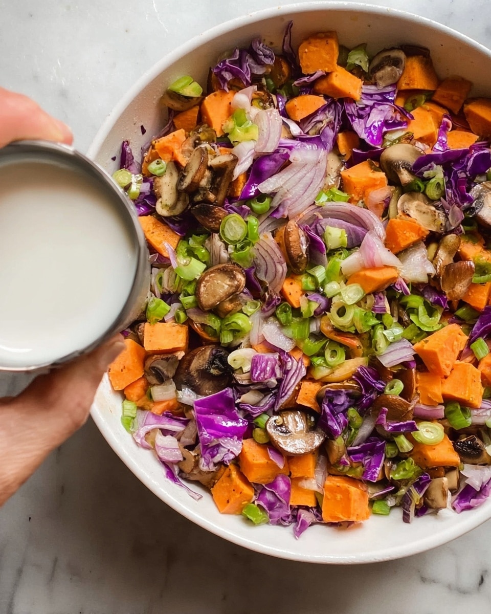 A white plate sits on a white marbled surface filled with a bed of white rice as the bottom layer, topped with a mix of cooked vegetables including slices of brown mushrooms, orange carrot pieces, and bits of purple cabbage mixed with small chunks of pink meat. The vegetable and meat layer is garnished with green sliced herbs and sprinkled with white sesame seeds. A silver spoon rests on the left side of the plate, partially on the rice and vegetables. photo taken with an iphone --ar 4:5 --v 7