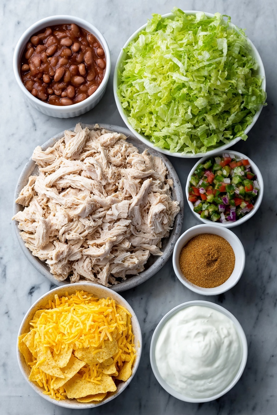 Flat lay of shredded cooked chicken piled loosely, a small white ceramic bowl of bright red chunky salsa, a small white ceramic bowl with golden brown taco seasoning powder, a small white ceramic bowl of smooth refried beans, a small mound of shredded sharp cheddar cheese, a handful of crushed yellow corn tortilla chips scattered neatly, a small pile of fresh shredded green lettuce, a small white ceramic bowl filled with colorful pico de gallo (diced tomatoes, onions, cilantro, and peppers), and a small white ceramic bowl of creamy white sour cream, all arranged symmetrically in balanced proportions, placed on a clean white marble surface, soft natural light, photo taken with an iPhone, professional food photography style, fresh ingredients, white ceramic bowls, no bottles, no duplicates, no utensils, no packaging --ar 2:3 --v 7 --p m7354615311229779997 - Loaded Chicken Taco Casserole, chicken taco casserole, cheesy taco bake, Mexican-inspired chicken casserole, easy taco casserole recipe