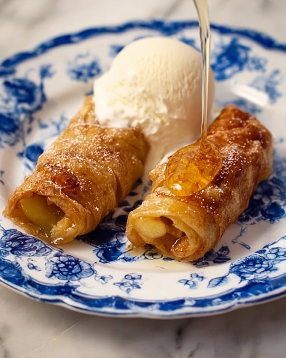 The image shows a simple kitchen table with a collection of ingredients carefully arranged. In the front center, a white bowl holds a smooth, white powdery substance. To the left, two bright green apples stand next to a tall yellow-topped container of ground cinnamon with a red label. Behind the bowl, there are two blue packages of crescent dough rolls standing upright side by side. To the right of the packages, two green soda cans labeled Mountain Dew are stacked one on top of the other. Next to the cans, two sticks of pale yellow butter are placed horizontally in front of a red-capped bottle of pure vanilla extract. The background is softly blurred, showing light wood furniture, and the table surface is a smooth reflective gray. photo taken with an iphone --ar 4:5 --v 7