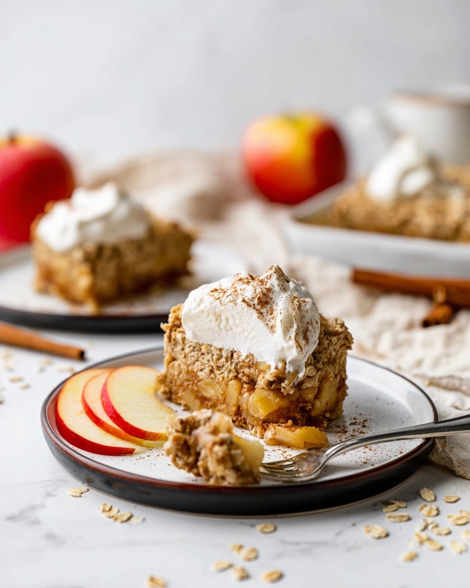 The image shows several ingredients arranged neatly on a white marbled surface with a soft, light pink cloth draped around them. In the center, there is a white bowl filled with light tan rolled oats. To the right, a white bowl contains small cubes of red and yellow apple pieces. Below it, a small white pitcher holds a thick yellow liquid with some bubbles on top. Above the oats bowl, there is a small rustic brown bowl with white salt and another small bowl with dark liquid, likely vanilla extract. On the left side, a clear glass pitcher is filled with white milk, next to it is a white bowl with a transparent liquid, possibly water, and a small white bowl with a dark brown thick syrup. Below those, there is a small dark bowl of light brown powder, likely cinnamon, and another small bowl containing pale powder, probably baking soda. The arrangement is clean and well spaced on the white marbled surface. photo taken with an iphone --ar 4:5 --v 7