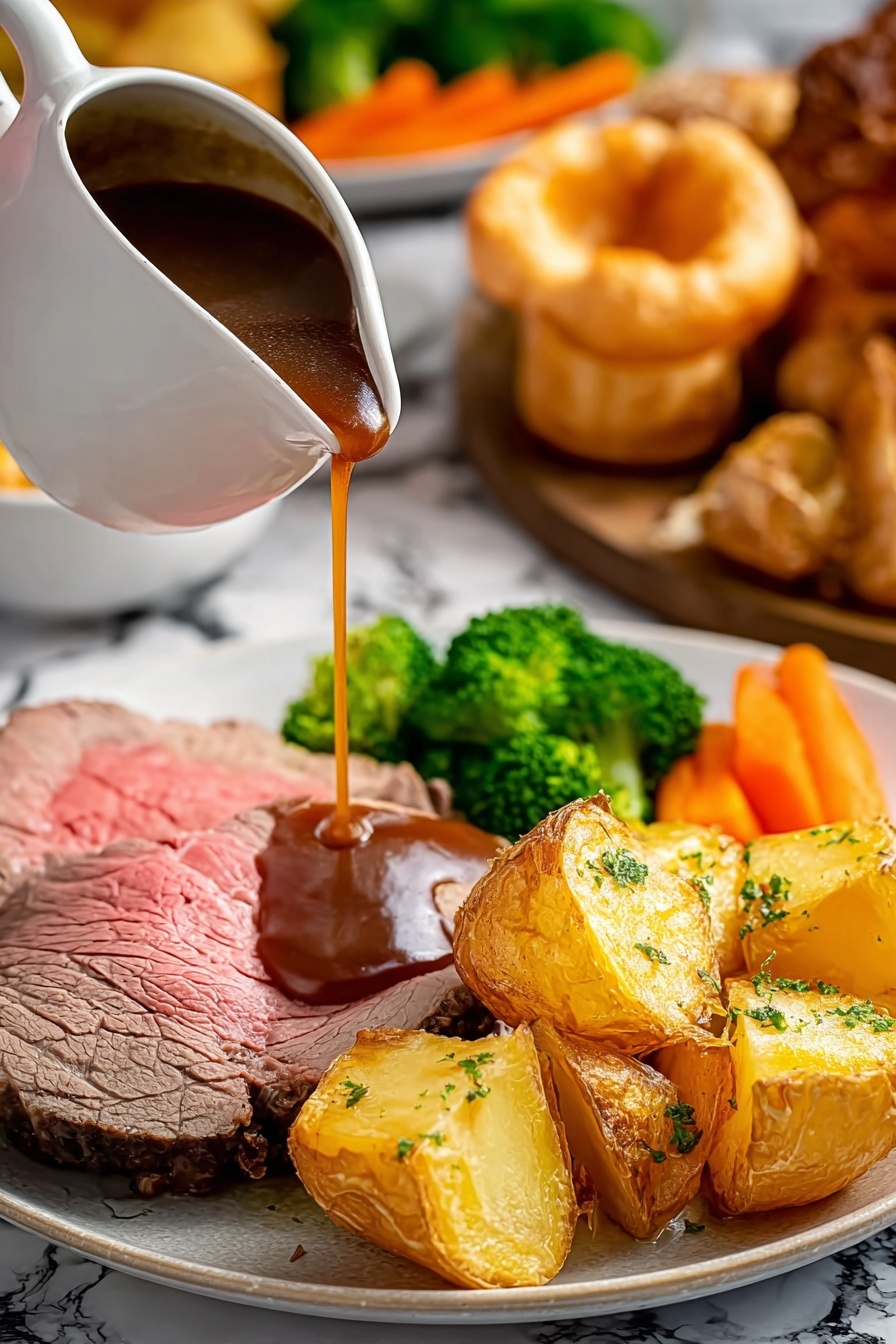 A white plate holds a meal with five main layers: at the bottom, a slice of pink center roasted beef with a brown seared outside; on top of the beef, thick dark brown gravy is being poured from a white gravy boat; next to the beef, golden roasted potatoes with crispy edges and green herbs on the surface; behind the potatoes, bright green broccoli florets and soft orange carrots; on the far right, a golden puffed Yorkshire pudding with a light crispy texture. The background is a white marbled surface with blurred roasted meat and other vegetables in soft focus. Photo taken with an iphone --ar 2:3 --v 7 - Perfect Roast Beef Dinner, roast beef with crispy potatoes, Sunday roast ideas, traditional roast dinner, easy roast beef tips