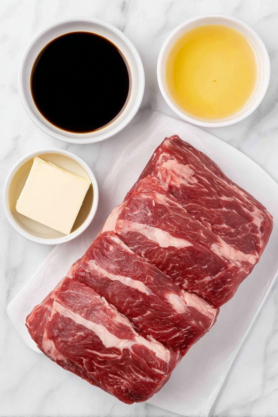 Flat lay of a whole raw beef tenderloin roast with rich red color and marbling, a small white ceramic bowl filled with dark glossy soy sauce, a small white ceramic bowl containing melted golden butter, all arranged in perfect symmetry on a clean white marble surface, soft natural light, photo taken with an iPhone, professional food photography style, fresh ingredients, white ceramic bowls, no bottles, no duplicates, no utensils, no packaging --ar 2:3 --v 7 --p m7354615311229779997 - Sweet Soy Butter Beef Tenderloin, beef tenderloin with soy butter, simple beef tenderloin recipe, baked beef tenderloin, flavorful beef dinner