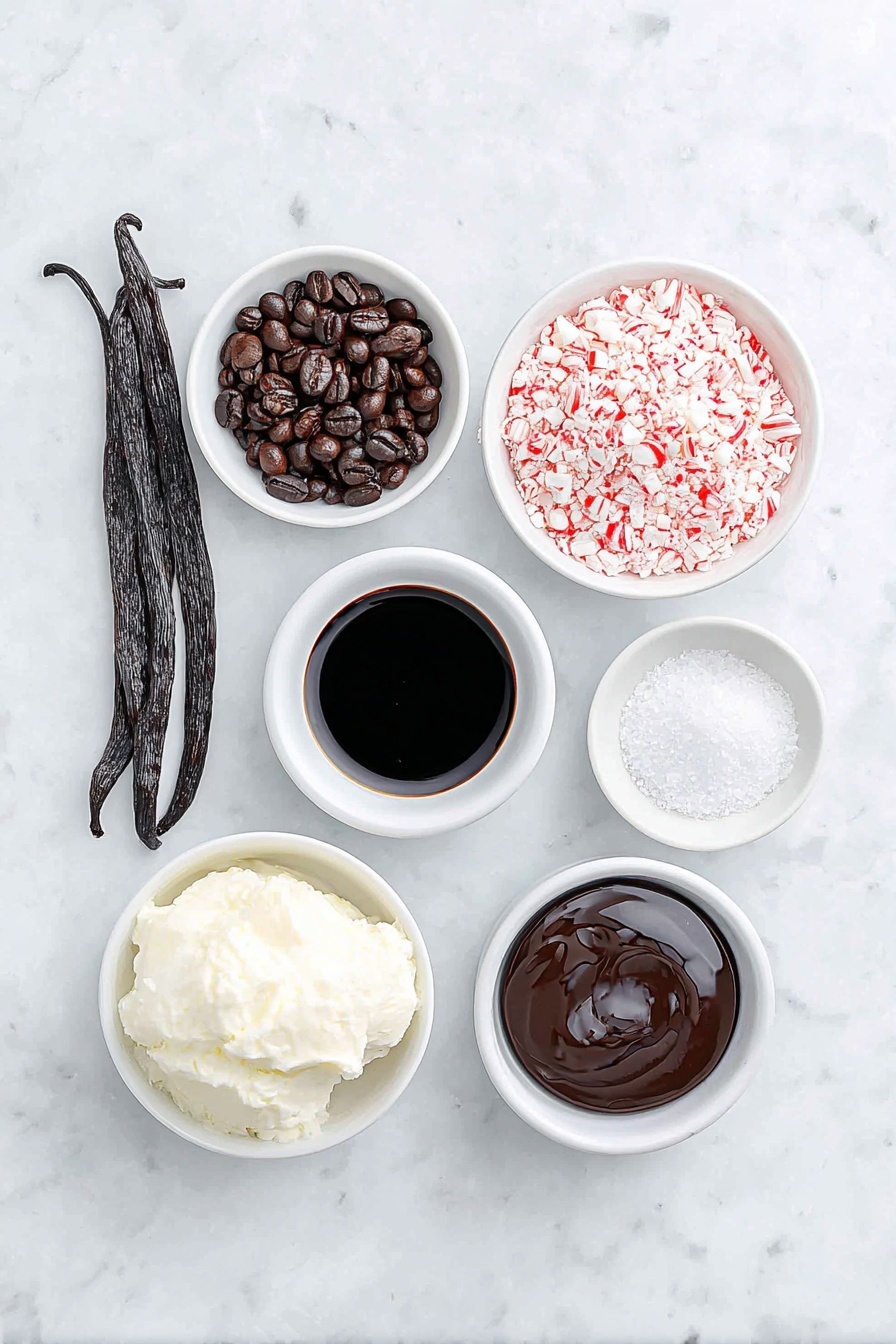 Flat lay of fresh whole vanilla bean pod, two glossy dark roasted espresso beans, a small white ceramic bowl of rich black espresso, a small white ceramic bowl with creamy half & half, a small white ceramic bowl of smooth dark coffee liqueur, a small white ceramic bowl of clear peppermint extract, a small white ceramic bowl filled with crushed red and white candy cane pieces, and a small white ceramic bowl of glossy chocolate syrup, all arranged in perfect symmetry, placed on a clean white marble surface, soft natural light, photo taken with an iPhone, professional food photography style, fresh ingredients, white ceramic bowls, no bottles, no duplicates, no utensils, no packaging --ar 2:3 --v 7 --p m7354615311229779997 - Peppermint Espresso Martini, festive cocktail recipes, holiday drinks with espresso, peppermint and vodka cocktails, easy holiday cocktail ideas
