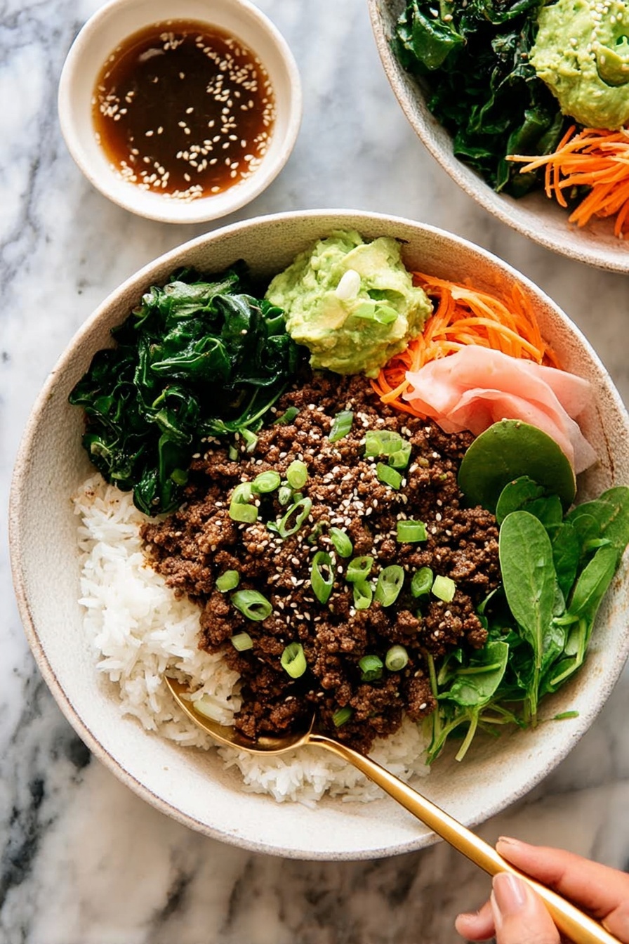 The dish is served in a white bowl filled with three main layers: at the bottom is a bed of white rice mixed with small green vegetables and thin orange carrot strips, on top is a layer of crumbly cooked brown ground meat, and on one side there are fresh green leafy lettuce and soft pink pickled ginger slices. In the center of the bowl, a small dollop of green mashed avocado is sprinkled with white sesame seeds and chopped green onions. A gold spoon rests inside the bowl against the edge, and the bowl sits on a white marbled surface next to a white cloth napkin. Photo taken with an iphone --ar 2:3 --v 7 - Korean Beef Bulgogi Rice Bowls, Bulgogi Beef Bowl, Korean-inspired rice bowl, easy bulgogi recipe, savory beef rice bowl